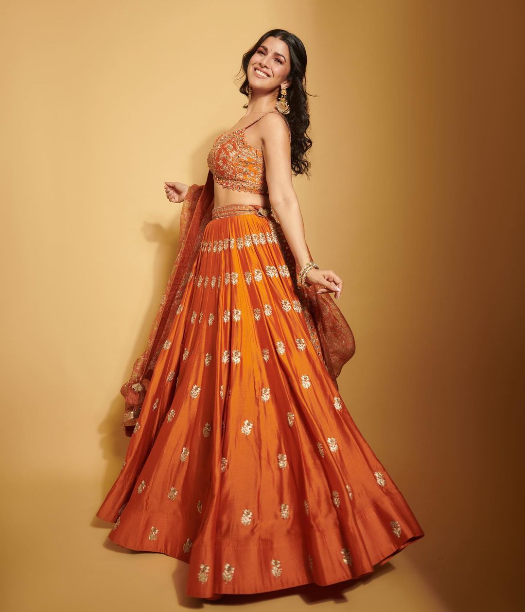 Bollywood Actress Nimrat Kaur Stills In Orange Lehenga Choli